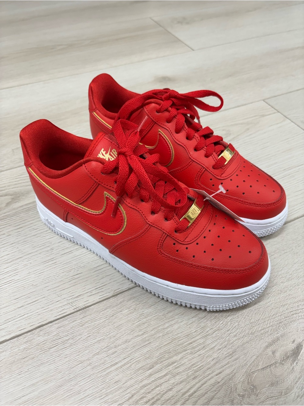 Nike Women’s Airforce 1 ‘07 Essential ‘Red Gold Swoosh’ Sneakers
